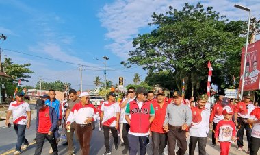 Hari Jadi Desa Simpang Beringin, Bupati Pelelawan Ikuti Gerak Jalan Santai Dan Senam Sehat Bersama Masyarakat