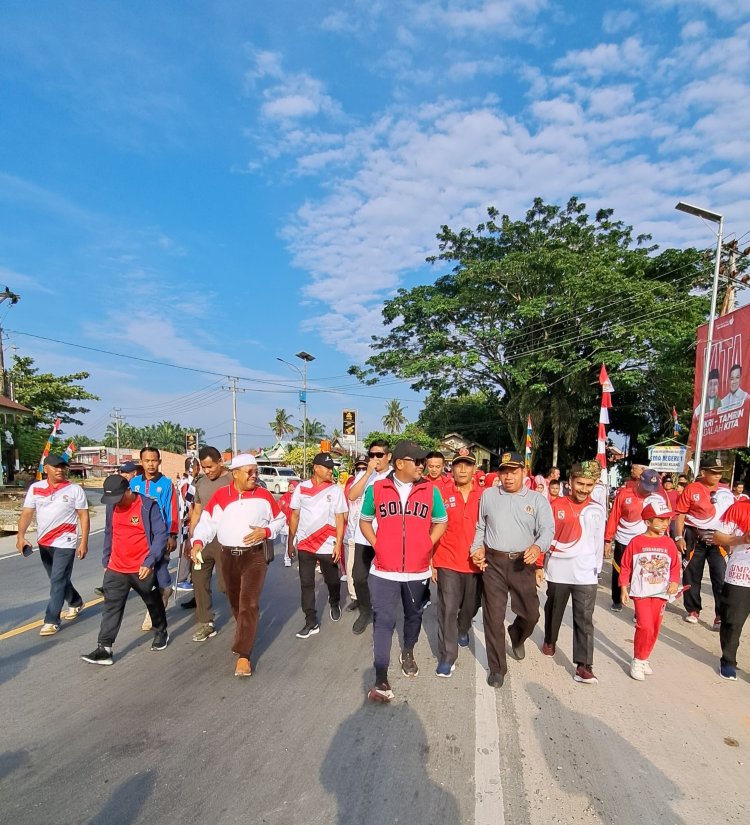 Hari Jadi Desa Simpang Beringin, Bupati Pelelawan Ikuti Gerak Jalan Santai Dan Senam Sehat Bersama Masyarakat